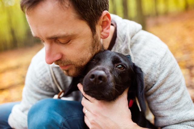 A thoughtful person contemplating pet adoption