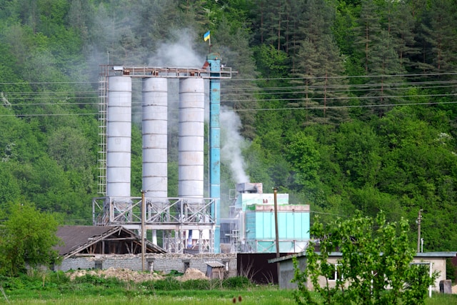 Carbon capture facility with smokestacks and monitoring equipment