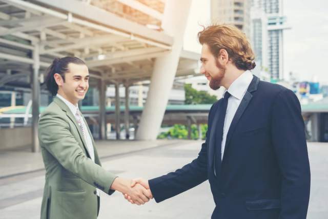 People shaking hands, symbolizing trust and empathy