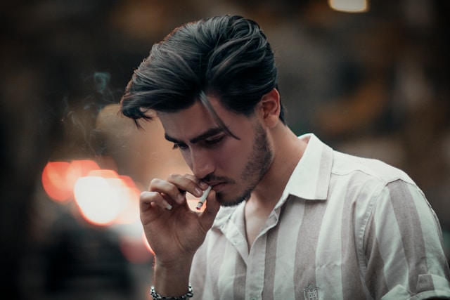 Person looking conflicted thinking about smoking and health