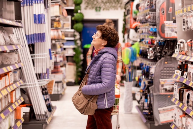 Person overwhelmed by many product options on store shelves